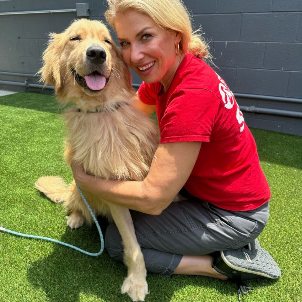 SPCA International staff member with dog rescued from the dog meat trade.